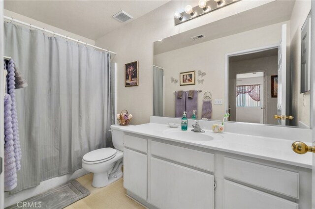 16290 Via Ultimo, Moreno Valley, CA 92551 - bathroom with vanity, toilet, and a shower with shower curtain