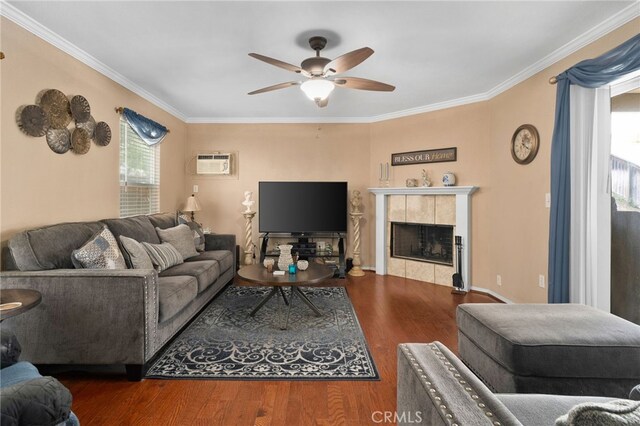 16290 Via Ultimo, Moreno Valley, CA 92551 - living room with a ceiling fan, crown molding, wood finished floors, an AC wall unit, and a tile fireplace