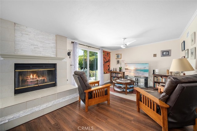 4435 Via Del Prado, Yorba Linda, CA 92886 - living area with a large fireplace, dark wood-style floors, ceiling fan, and ornamental molding
