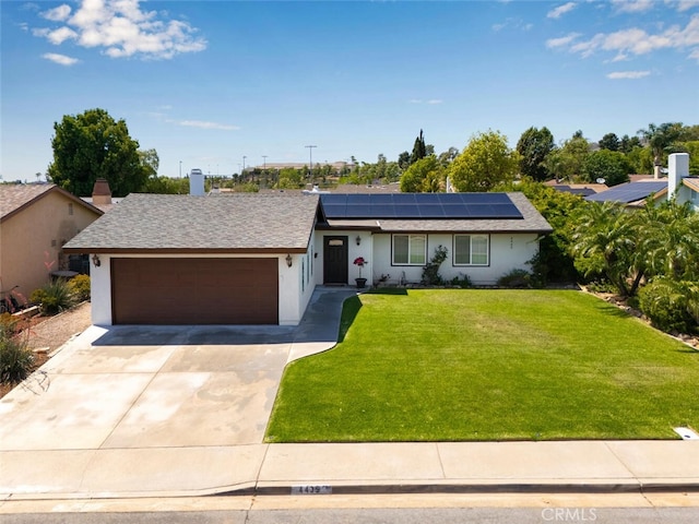4435 Via Del Prado, Yorba Linda, CA 92886 - single story home with an attached garage, roof mounted solar panels, concrete driveway, a front yard, and stucco siding