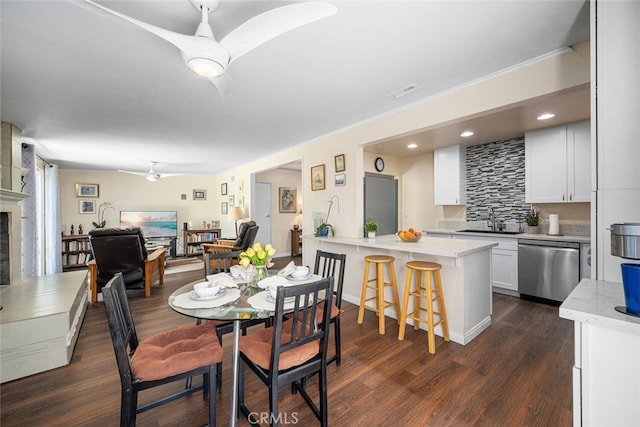 4435 Via Del Prado, Yorba Linda, CA 92886 - dining room with dark wood-style flooring, a fireplace, crown molding, and ceiling fan