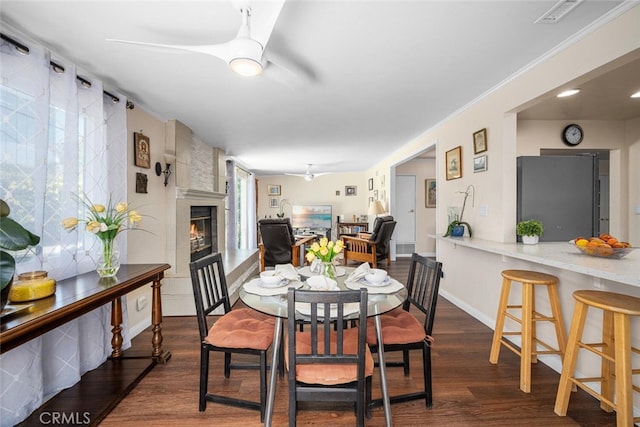 4435 Via Del Prado, Yorba Linda, CA 92886 - dining area with a ceiling fan, dark wood finished floors, and a fireplace