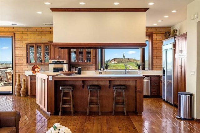 5010 Gate 4 Rd, Paso Robles, CA 93446 - bar with appliances with stainless steel finishes, dark wood-style floors, plenty of natural light, recessed lighting, and brick wall