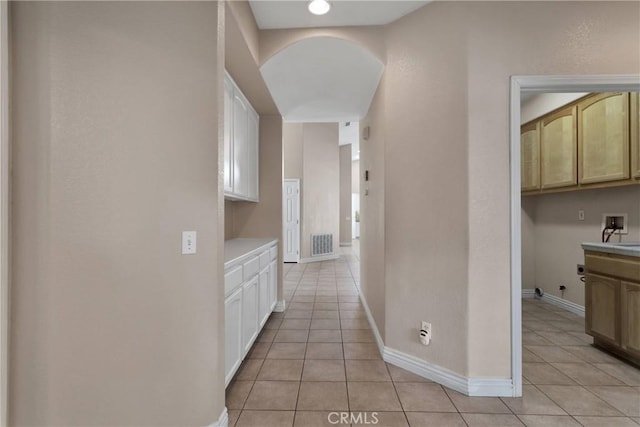 6786 Middleton Ave, Hesperia, CA 92345 - corridor featuring light tile patterned floors