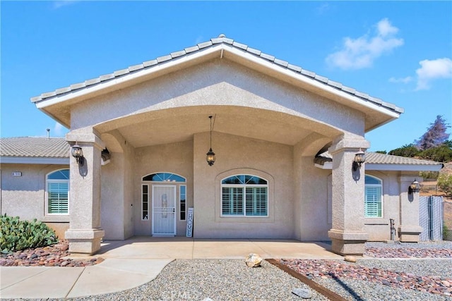 6786 Middleton Ave, Hesperia, CA 92345 - property entrance featuring stucco siding and a tile roof