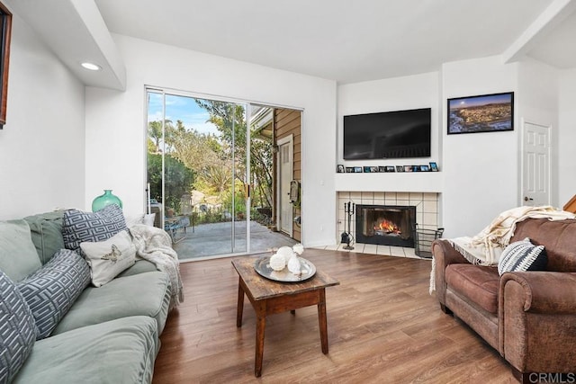 8585 Via Mallorca Unit 11, La Jolla, CA 92037 - living room featuring wood finished floors, a tile fireplace, and recessed lighting