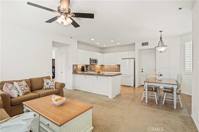 26974 Colonial Ln, Valencia, CA 91355 - living room with ceiling fan, light colored carpet, light tile patterned floors, and recessed lighting