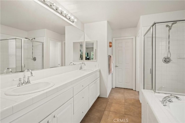 26974 Colonial Ln, Valencia, CA 91355 - bathroom featuring a stall shower, double vanity, a garden tub, and tile patterned flooring