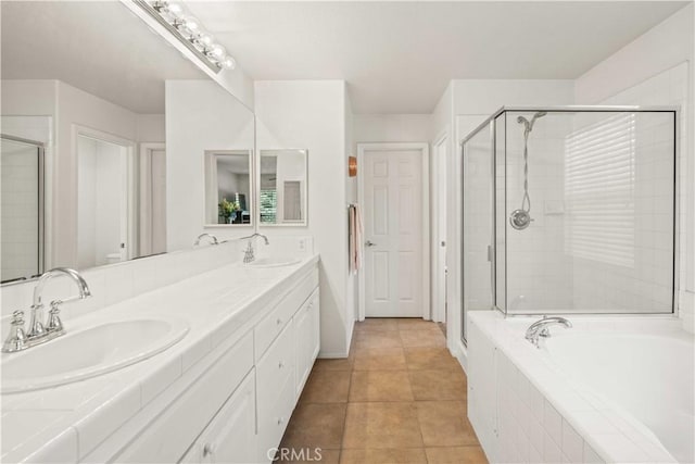 26974 Colonial Ln, Valencia, CA 91355 - full bath featuring a garden tub, double vanity, a shower stall, and tile patterned flooring