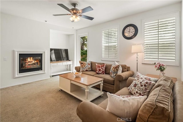 26974 Colonial Ln, Valencia, CA 91355 - living area with a glass covered fireplace, ceiling fan, and carpet flooring