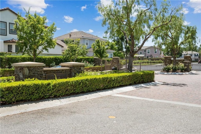 26974 Colonial Ln, Valencia, CA 91355 - community sign featuring a gate and a residential view