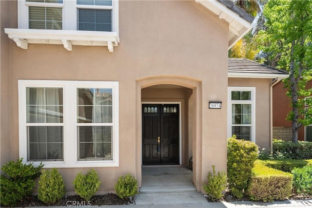 26974 Colonial Ln, Valencia, CA 91355 - doorway to property featuring stucco siding