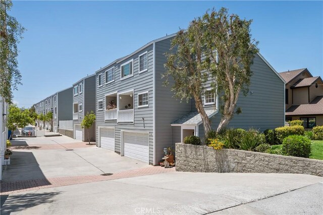25839 Cypress St Unit B, Lomita, CA 90717 - view of front of property featuring driveway and a garage