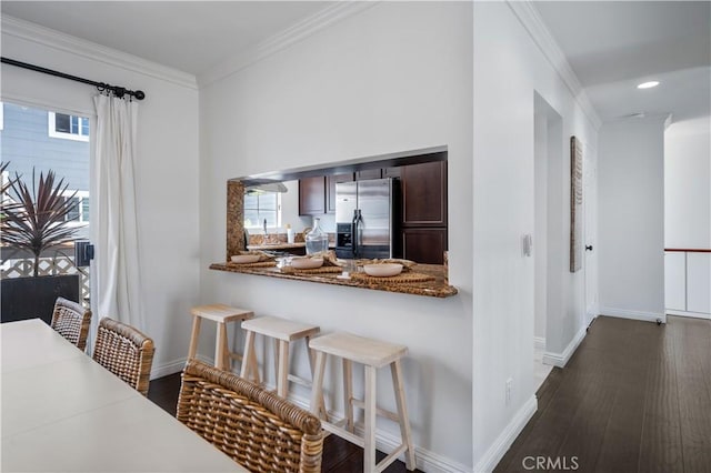 25839 Cypress St Unit B, Lomita, CA 90717 - kitchen with stainless steel refrigerator with ice dispenser, baseboards, dark wood-style floors, crown molding, and a breakfast bar