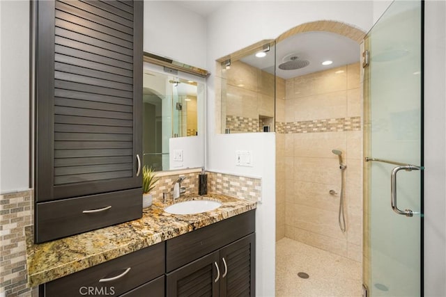 13061 Rosalind Dr, North Tustin, CA 92705 - full bathroom with a shower stall, vanity, and backsplash