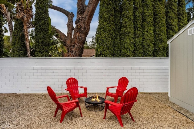 13061 Rosalind Dr, North Tustin, CA 92705 - fenced backyard featuring an outdoor fire pit