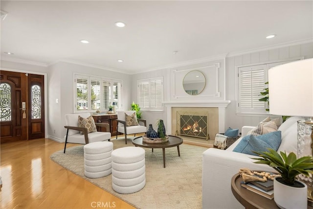 13061 Rosalind Dr, North Tustin, CA 92705 - living room with crown molding, light wood-type flooring, recessed lighting, baseboards, and a warm lit fireplace