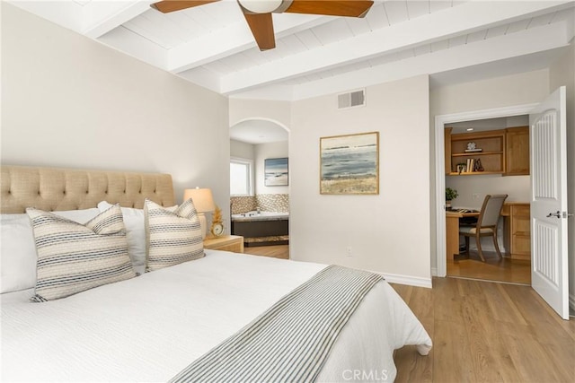 13061 Rosalind Dr, North Tustin, CA 92705 - bedroom featuring light wood-style flooring, arched walkways, a desk, ceiling fan, and baseboards