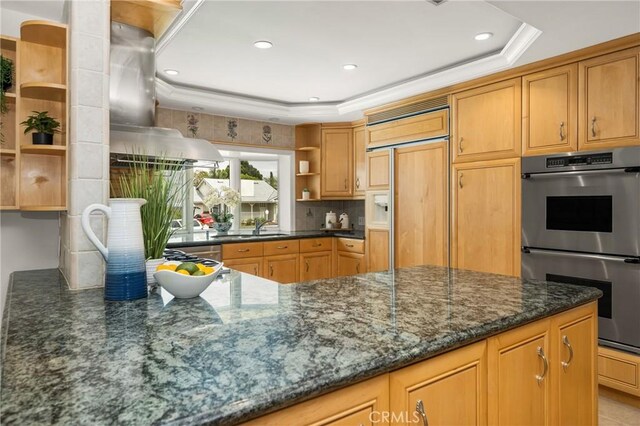 13061 Rosalind Dr, North Tustin, CA 92705 - kitchen with open shelves, double oven, a tray ceiling, paneled refrigerator, and dark stone counters