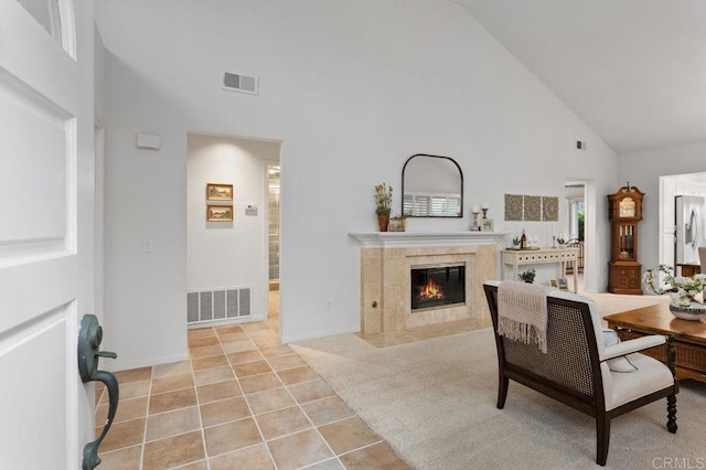 7414 Lantana, Carlsbad, CA 92011 - dining area featuring high vaulted ceiling, a tiled fireplace, and light tile patterned floors