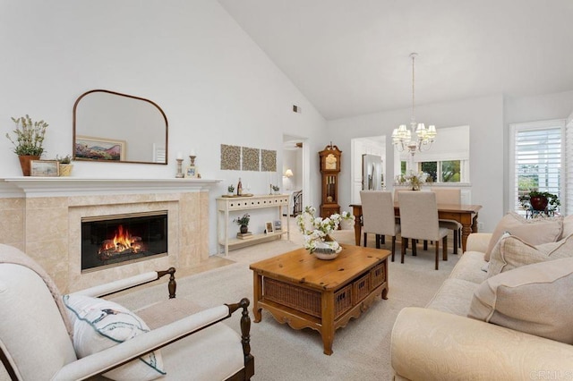 7414 Lantana, Carlsbad, CA 92011 - carpeted living room featuring a chandelier, high vaulted ceiling, and a high end fireplace