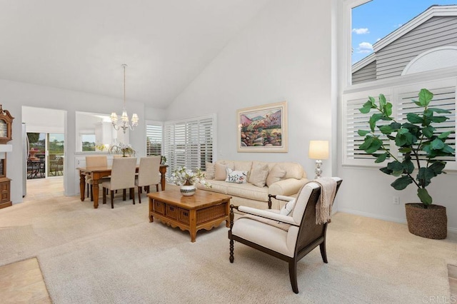 7414 Lantana, Carlsbad, CA 92011 - living area with high vaulted ceiling, light carpet, a chandelier, and healthy amount of natural light