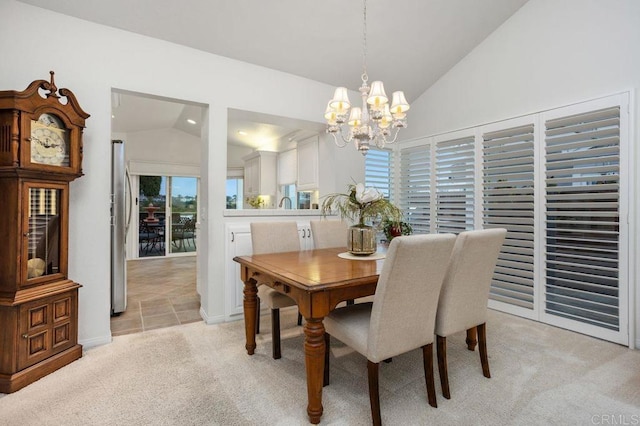 7414 Lantana, Carlsbad, CA 92011 - dining area with lofted ceiling, a chandelier, and light colored carpet