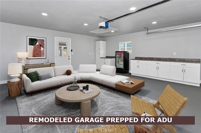7710 Shoup Ave, West Hills, CA 91304 - living room with recessed lighting, a garage, and baseboards