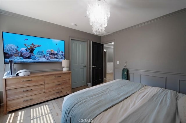 5239 Jade Ct, Lancaster, CA 93536 - bedroom featuring a chandelier, ornamental molding, and wainscoting