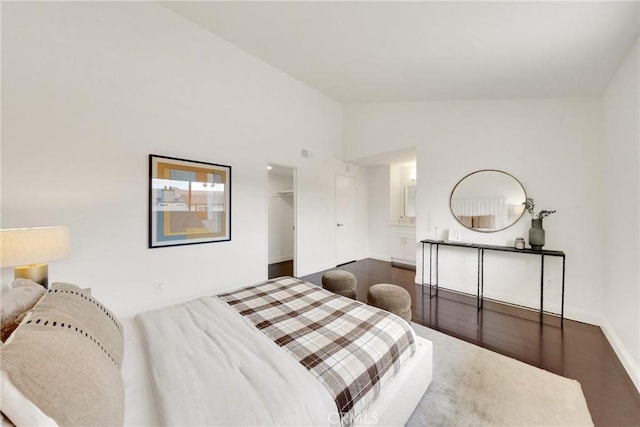 187 S Catalina Ave Unit 4, Pasadena, CA 91106 - bedroom with wood finished floors, baseboards, and high vaulted ceiling