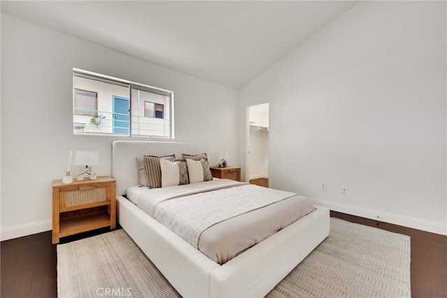 187 S Catalina Ave Unit 4, Pasadena, CA 91106 - bedroom with lofted ceiling, baseboards, wood finished floors, and a walk in closet