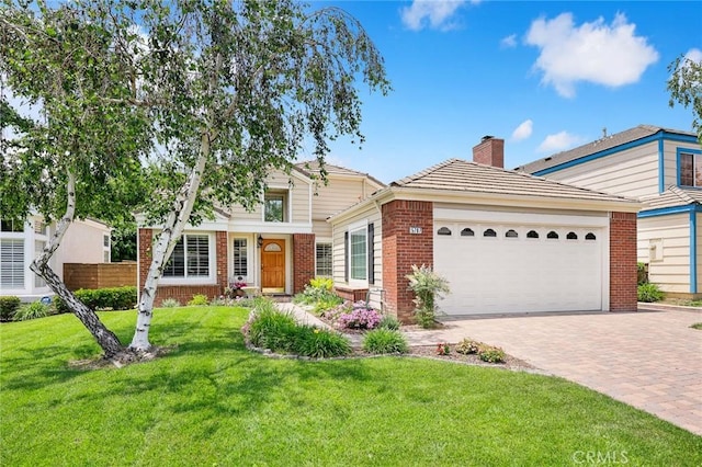 5787 Blackbird Ln, La Verne, CA 91750 - view of front facade featuring brick siding, an attached garage, decorative driveway, a front yard, and a chimney