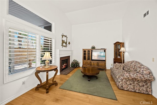5787 Blackbird Ln, La Verne, CA 91750 - living room with wood finished floors, a fireplace, baseboards, and high vaulted ceiling