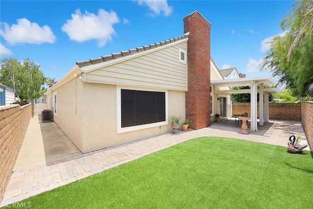 5787 Blackbird Ln, La Verne, CA 91750 - rear view of house with stucco siding, a patio area, central AC, a chimney, and a tiled roof