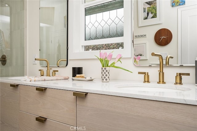 3231 Ruth Elaine Dr, Los Alamitos, CA 90720 - bathroom featuring double vanity and tiled shower