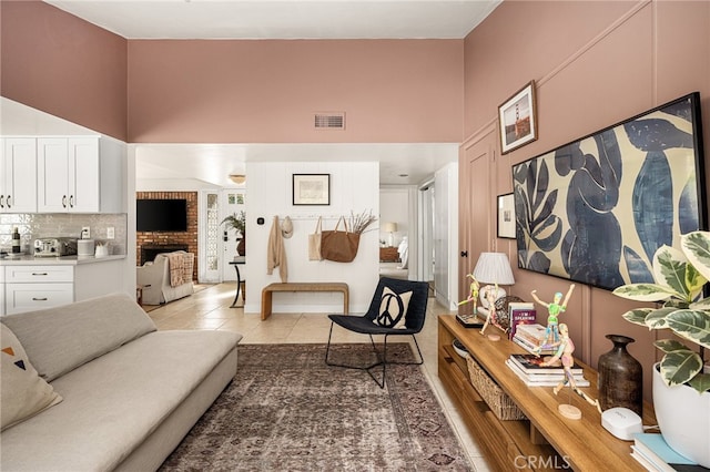 3231 Ruth Elaine Dr, Los Alamitos, CA 90720 - living room featuring a towering ceiling and light tile patterned floors