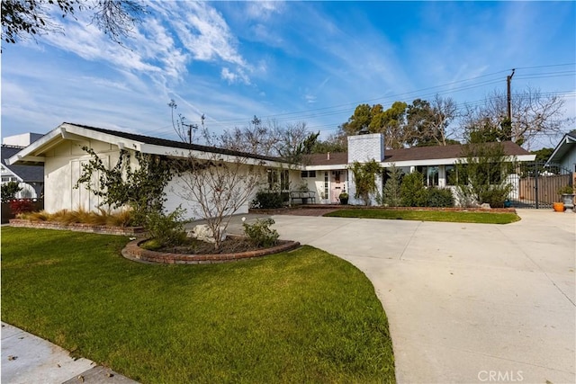 3231 Ruth Elaine Dr, Los Alamitos, CA 90720 - ranch-style house with curved driveway and a chimney