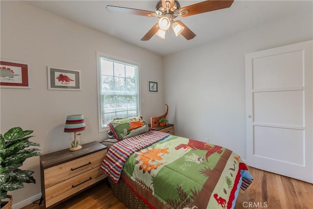 7704 Isis Ave, Los Angeles, CA 90045 - bedroom with wood finished floors and ceiling fan