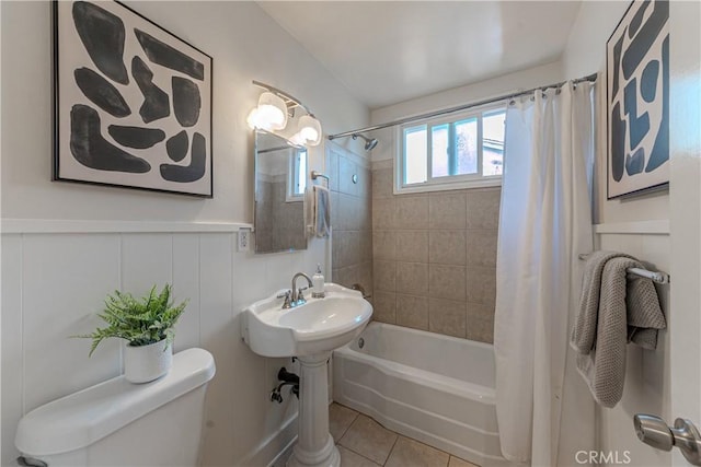 7704 Isis Ave, Los Angeles, CA 90045 - bathroom with toilet, shower / tub combo with curtain, tile patterned floors, and wainscoting