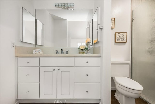 2726 Torrey Pine Dr Unit 12, Fullerton, CA 92835 - bathroom featuring vanity, toilet, and an enclosed shower