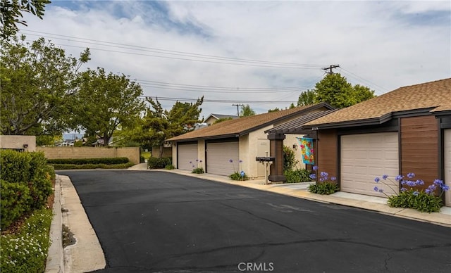 2726 Torrey Pine Dr Unit 12, Fullerton, CA 92835 - ranch-style home featuring an outbuilding and roof with shingles