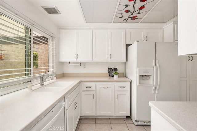 2726 Torrey Pine Dr Unit 12, Fullerton, CA 92835 - kitchen with a sink, light tile patterned flooring, white cabinetry, white appliances, and light countertops