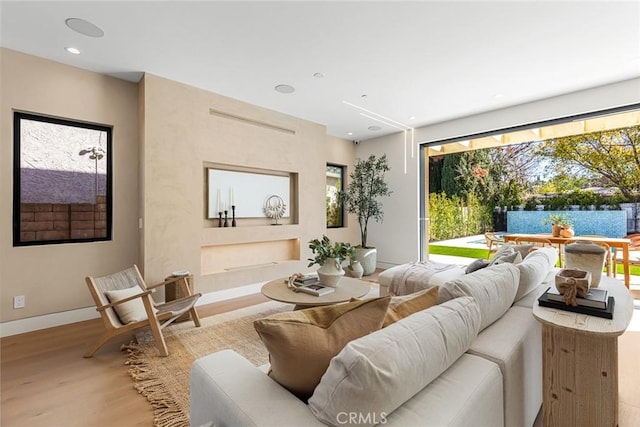 22640 Clarendon St, Woodland Hills, CA 91367 - living room featuring wood finished floors, healthy amount of natural light, and recessed lighting
