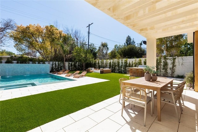 22640 Clarendon St, Woodland Hills, CA 91367 - fenced backyard with a patio, outdoor dining area, an outdoor hangout area, and a pool with connected hot tub