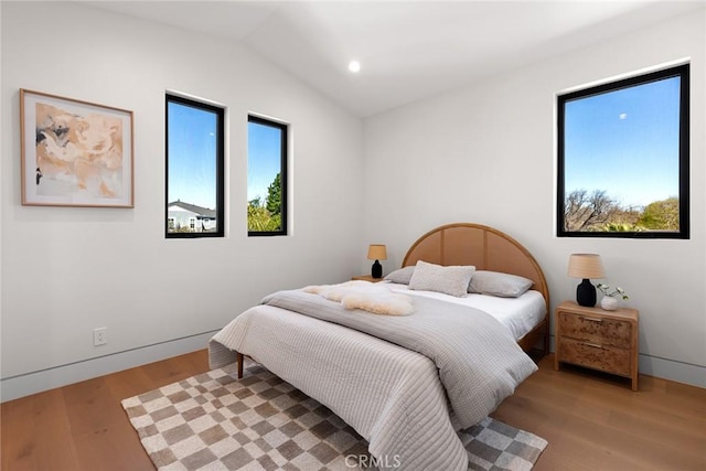 22640 Clarendon St, Woodland Hills, CA 91367 - bedroom with light wood-style flooring, vaulted ceiling, and recessed lighting