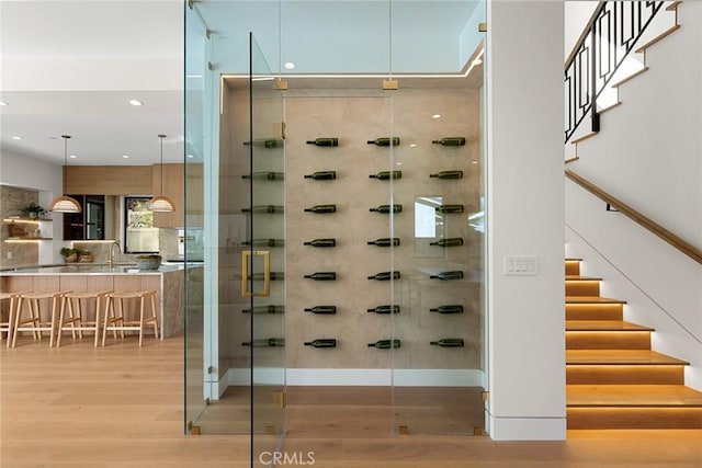 22640 Clarendon St, Woodland Hills, CA 91367 - wine cellar with light wood-type flooring and recessed lighting