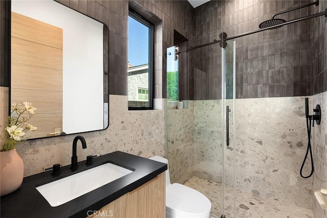 22640 Clarendon St, Woodland Hills, CA 91367 - bathroom with a stall shower, vanity, and tile walls