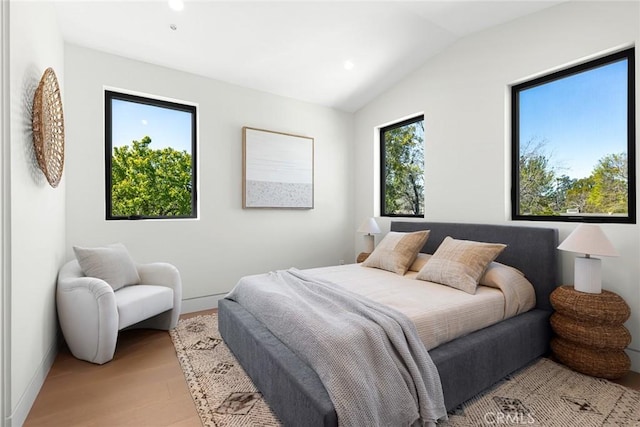 22640 Clarendon St, Woodland Hills, CA 91367 - bedroom with light wood finished floors, lofted ceiling, and recessed lighting