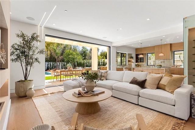 22640 Clarendon St, Woodland Hills, CA 91367 - living area featuring light wood-style flooring and recessed lighting