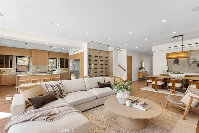 22640 Clarendon St, Woodland Hills, CA 91367 - living area with light wood-type flooring, stairway, and recessed lighting